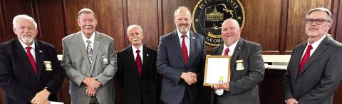 Near the start of the Feb. 2 Putnam County Commission meeting, former Eatonton city attorney Barry Fleming (4th from left) was recognized for being appointed Jan. 10 as a Columbia County Superior Court Judge. Fleming was presented with a certificate and will soon receive a custom-made gavel from (l-r) Putnam County Commission Chair Bill Sharp and Commissioners Gary McElhenney, Steve Hersey, Jeff Wooten, and Daniel Brown. IAN TOCHER/Staff