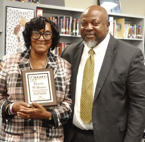 Superintendent Derick Austin (right) with HEART recipient Florrie Willaims. BAILEY BALLARD/Staff