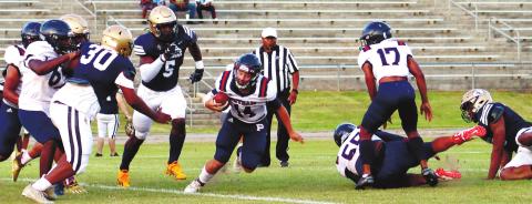 Rhimiair Johnson (55) and Cory Foster (17) make a block for quarterback Branan Griffin (14). ARELLA CASH/Staff