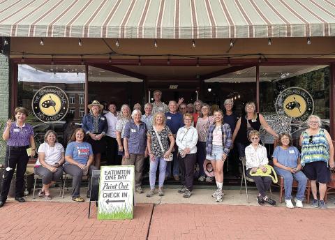 Attendees of the 8th annual Paint Out pose in front of the Artisan Village Guild. CONTRIBUTED