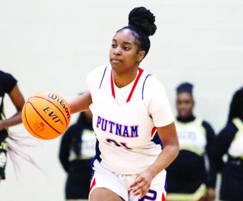 Putnam County senior Kamyra Aikens continues to prove her worth to the Lady War Eagles by becoming a thousand-point scorer while simultaneously playing a strong defensive game. LANCE McCURLEY/Staff