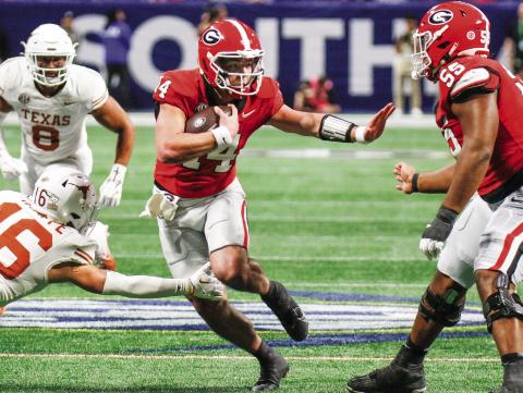 Gunner Stockton (14) will start at quarterback for Georgia against Notre Dame in the Allstate Sugar Bowl on Jan. 1. LANCE McCURLEY/Staff
