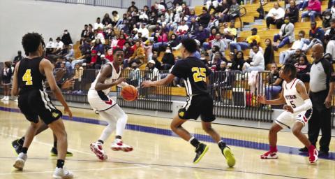 Putnam County's Eren Banks (3) drives the lane against an opponent last season. ARELLA CASH/Staff