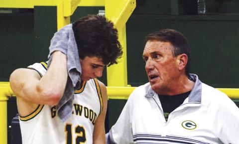 Gatewood head coach Don Keiser talks with leading scorer Matt Allen during a break last Friday night during a game against Mount de Sales Academy out of Macon. IAN TOCHER/Staff
