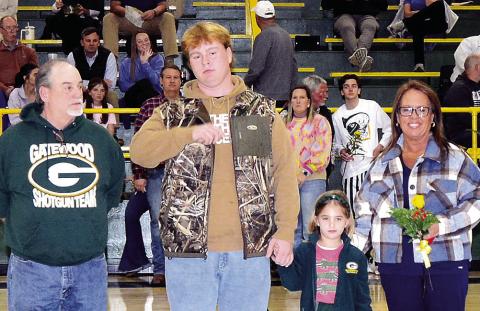 Gatewood wrestler and football team member Blake Daniel was escorted by his parents Lorraine and Roger, with K-5 buddy Averly Smith. Blake plans to attend Emmanuel College to earn a degree in business management. IAN TOCHER/Staff