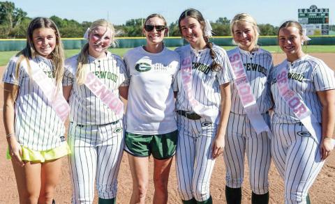 Gatewood softball coach Dena Stancil (center, green shorts) poses with her senior players this season (l-r): Natalie Sills, Lily Huskins, Riley Roberts, Ellie McMillian, and Cora Tkacik. CONTRIBUTED