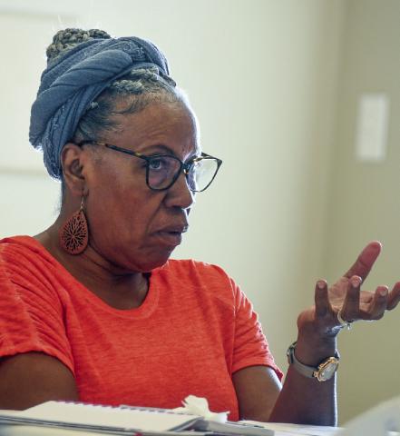 JDP council member Patricia Bailey makes a point about a proposed initiative to donate school supplies. IAN TOCHER/Staff
