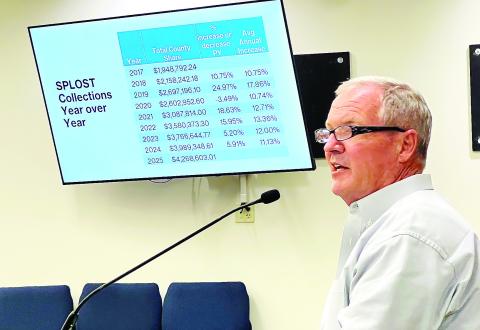 Putnam County Manager Paul Van Haute addresses local politicians on Monday, describing the history and potential of a local SPLOST. IAN TOCHER/Staff