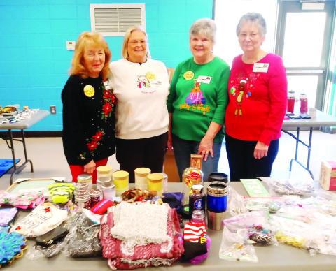L-R: Judy Fain, Linda Pressley, Gail Mills and Leonell Alligood work as Santa’s helpers at Santa’s Secret Workshop. CONTRIBUTED