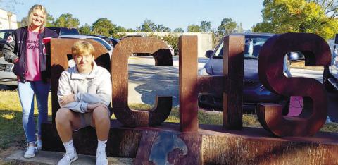 Tori Sheppard and Trenton Lewis on the PCHS sign in front of the high school. CONTRIBUTED
