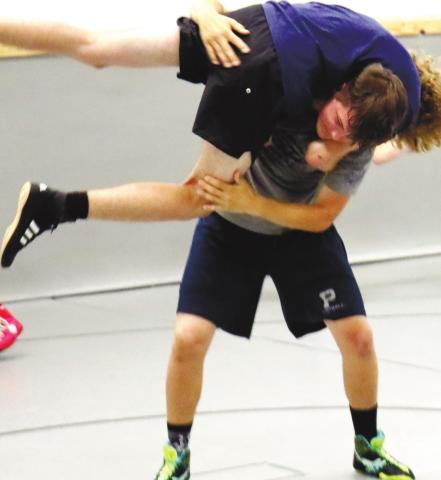 Senior Cooper Smallwood shows strength and patience during informal practice last week. ARELLA CASH/Staff