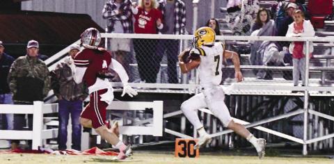 Evan Bennett (7) had a big night in Waynesboro, scoring four of five touchdowns for the Gatewood Gators in their 38-28 win over Edmund Burke Academy. DAWN SINCLAIR/Contributed