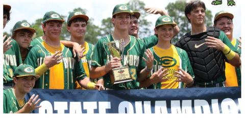Gatewood players pose with their fourth consecutive state championship trophy last Friday in Statesboro. TREY NORRIS/Staff