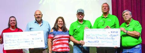 L-R: Conyers Honor Flight representatives Delores Thrash and Tony Wilson join VFW Thrift Store Manager Nikki Barker on The Plaza stage with Roger Jennings, Bob Long, and Randy Fabricius of Middle Georgia Honor Flight as they receive donations for Honor Flights scheduled later this year. CONTRIBUTED