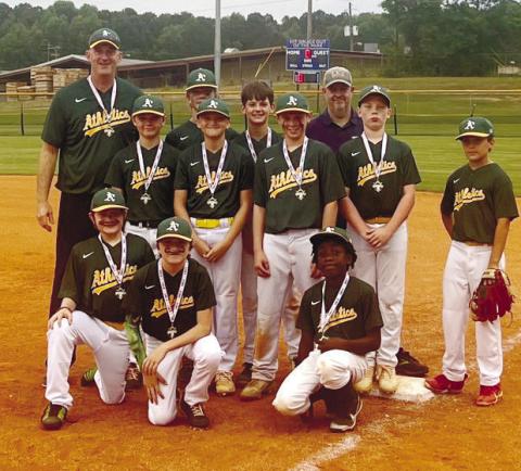 The Putnam A’s pose for a photo after winning the 11-and-12-year-old league championship. CONTRIBUTED