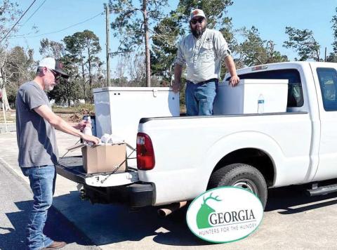 Earlier this fall, Georgia Wildlife Federation’s Sportsman’s Programs Specialist John Guthrie (left) and Sportsman’s Programs Manager Adam Schiavone dropped off more than 800 pounds of donated deer meet in Uvalda. CONTRIBUTED