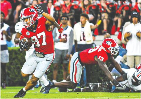 Georgia wide receiver Mehki Mews (87) breaks away from defenders on a 54-yard touchdown during Saturday’s win over UTMartin. CHARLES JORDAN/Contributed