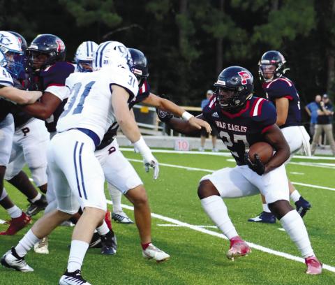 Putnam County running back Tamarion Peters (27) tries to find a hole through Oconee County’s defense. Peters also had a big impact against Jasper County. ARELLA CASH/File photo
