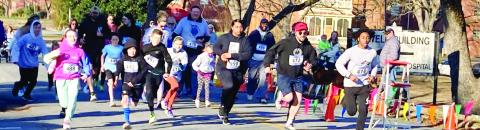 Some smiles, some serious faces during the Fun Run start. LYNN HOBBS/Staff