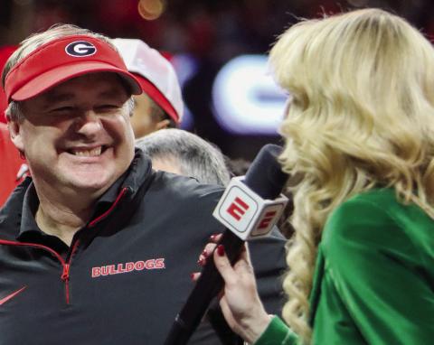 Georgia head coach Kirby Smart is all smiles during an interview with ESPN reporter Laura Rutledge after winning the SEC Championship game in Atlanta on Saturday. LANCE McCURLEY/Staff