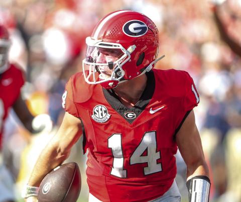 Georgia quarterback Gunner Stockton rumbles into the end zone for a rushing touchdown. LANCE McCURLEY/Staff