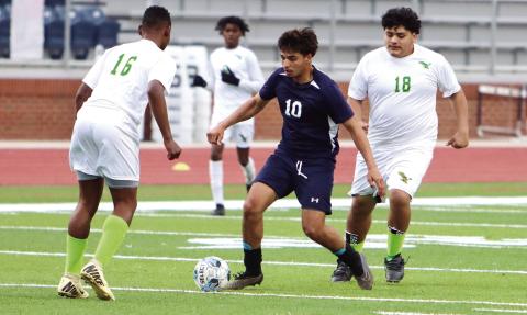 War Eagles’ leading scorer Emmanuel Meraz (10) weaves his way through several of Josey’s players before taking a shot on goal. LANCE MCCURLEY/Staff