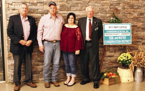 Shawn Raff (second from left) of Riff Raff Cattle was named Putnam County’s Conservationist of the Year by NRCS and the Piedmont Soil and Water Conservation District. CONTRIBUTED