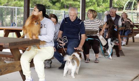 Pets and their people gather Friday for the annual Blessing of the Animals at Christ Our King and Savior Catholic Church in Greensboro. LEIGH LOFGREN/Staff