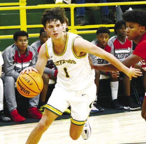 Jackson Morris (1) drives the lane against a YACS defender. IAN TOCHER/Staff