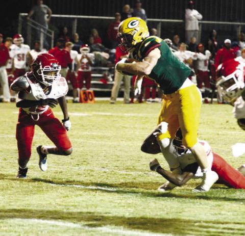 Gatewood’s Evan Bennett begins his leap toward the end zone to score the Gators’ lone touchdown Sept. 23, in a 42-7 loss to the visiting Pacelli Vikings. IAN TOCHER/Staff