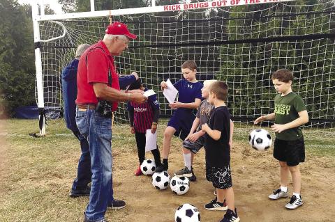 Lake Oconee Elks Soccer Shoot Chairman Bob Pluta delivers last-minute instructions to competitors at a previous Soccer Shoot event. CONTRIBUTED