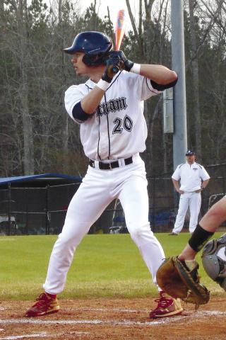 Putnam County senior Jacob Grimes (20) eyes down a Banks County pitcher. TREY NORRIS/Staff
