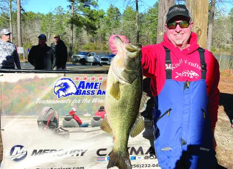 Aaron Batson with a hawg from Sinclair in the cold muddy water. CONTRIBUTED