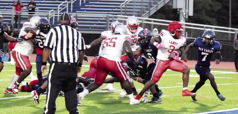 Laney’s Matthew White fights his way past Putnam defenders as he marches his way into the end zone. T. MICHAEL STONE/Staff