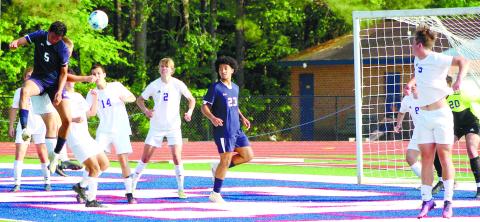 War Eagle Brad Reeves (5) sends a header in the air toward the Union County goal. ARELLA CASH/Staff