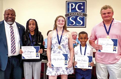 L-R: Superintendent Derick Austin named the March students of the month: Jai Hargrove, Abby Mashburn, Cobee Parham, and Jackson Stevenson. CONTRIBUTED