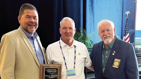 Putnam County District 1 Commissioner Tom McElhenney (left) and County Chairman Bill Sharp congratulate County Manager Paul Van Haute (center), who received the Jerry R. Griffin Excellence in Public Service Award on Saturday in Savannah. CONTRIBUTED