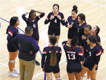 The Lady War Eagles talk things over with their coach.