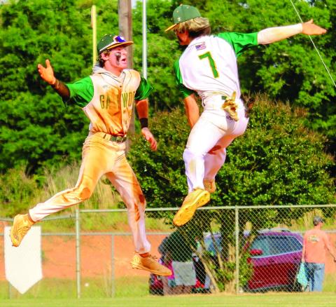 Hunter Johnson (left) and Ames Johnson (right) catch some big air as they celebrate a big win last season. TREY NORRIS/Staff