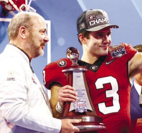 Georgia quarterback Stetson Bennett (13) was resilient after a tough start against Ohio State. On Georgia’s last two drives of the game, Bennett completed 5-of-5 passes for 148 yards and two TDs. He also passed for 190 yards in the fourth quarter. TONY WALSH/UGA Athletics