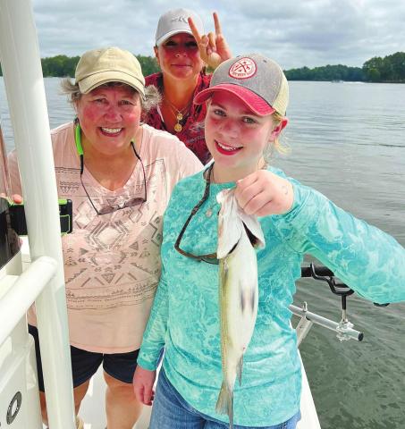 Annie, Nikki and Darcy with a big fish. CONTRIBUTED