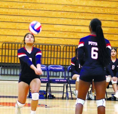 Leslye Arriola (9) with dig in region match vs Laney.