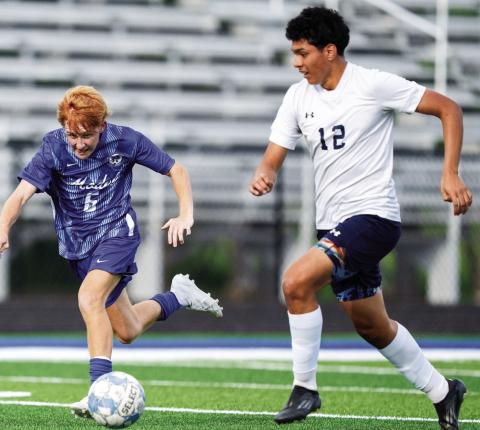 Model’s Brennan Dial (6) dribbles the ball away from Putnam County defender Dennis Sanchez (12). ZEKE PALERMO/Contributed