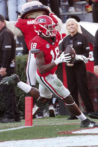 Georgia linebacker Chris Cole (18) recovered a Massachusetts fumble for a scoop and score. BRAD HARRISON/Staff