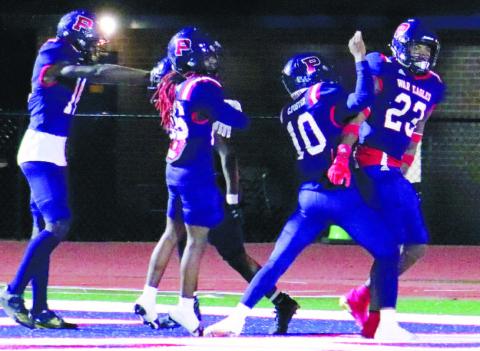 Jalon Kilgore (23) celebrates with teammates after his game-tying TD late in the fourth quarter against Laney on Friday night. ARELLA CASH/Staff