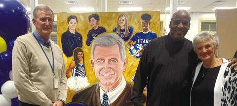 Artist James Threalkill (right) gifts LOA CEO Dr. Ortho Tucker a mural of Tucker for the new fine arts building. CONTRIBUTED