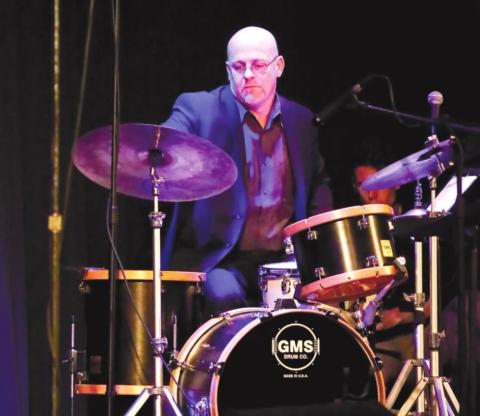 Bandleader and drummer Justin Varnes performs.