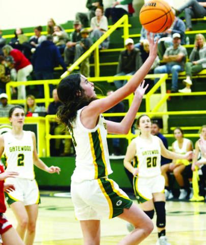 Gatewood freshman Riley Roberts (3) goes in for a layup as Sarah Mansfield (2) and Eliana Tkacik (20) look on. IAN TOCHER/Staff