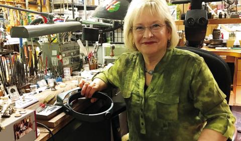 Georgia-based metal and jewelry artist Barbara Mann in her studio. CONTRIBUTED