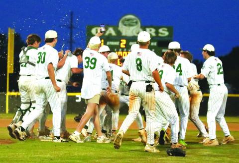 Gatewood celebrates on the field after sweeping Trinity Christian to clinch its sixth straight GIAA Class 2A state championship appearance. TREY NORRIS/Staff